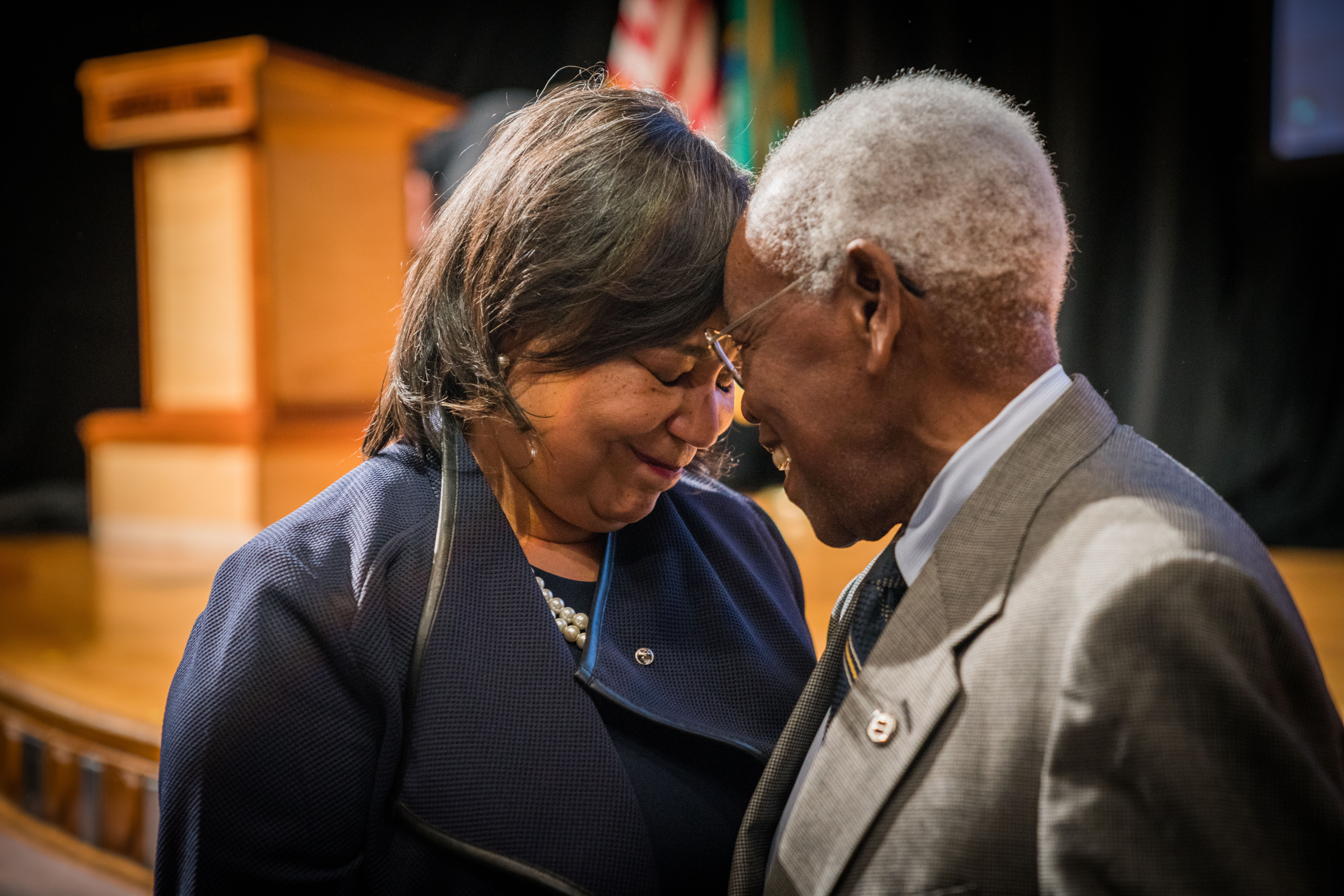 Mayor Victoria Woodards pauses to share a quiet moment with former Mayor Harold G. Moss after her first State of the City Address on April 11, 2018 at Lincoln High School in Tacoma, Washington. -- Courtesy of City of Tacoma
